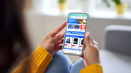 Person holding phone looking at Amazon Prime Day screen