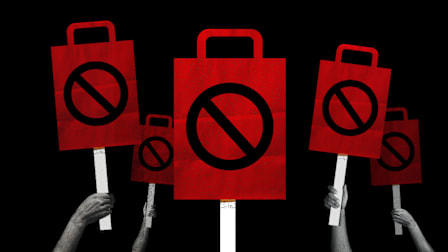 Photo illustration of multiple hands holding up protest signs in the shape of shopping bags.