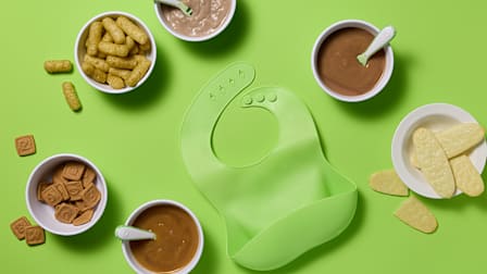 Tested baby foods on green background