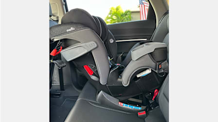 Evenflo All4One 4-in-1 convertible car seat seen rear-facing in the back seat of a vehicle.