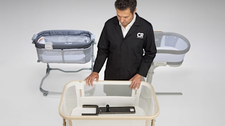 Consumer Reports Test Program Leader, Product Safety and Sustainability Juan Alberto Arguello Garcia Pertusa demonstrating a safety test by placing Hinge Gauge and Inclinometer in a cantilevered bassinet.