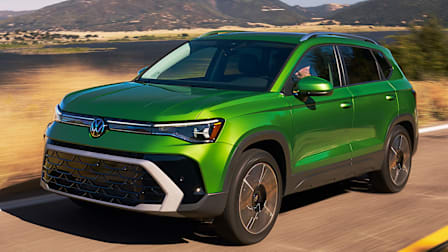 Bright green 2025 Volkswagen Taos driving