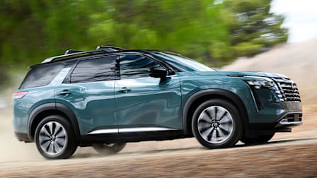 2026 Nissan Pathfinder driving up a dirt road