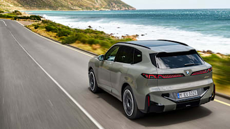 2027 BMW X5 driving along a coast
