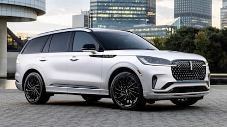 grey Lincoln Aviator with city buildings in background