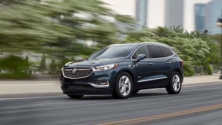 2021 Buick Enclave driving on an urban highway.