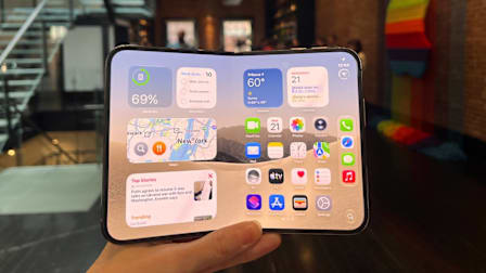 A hand holding the new iPhone Duo.