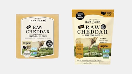 block and shredded RAW FARM-brand Raw Cheddar Cheeses on light grey background