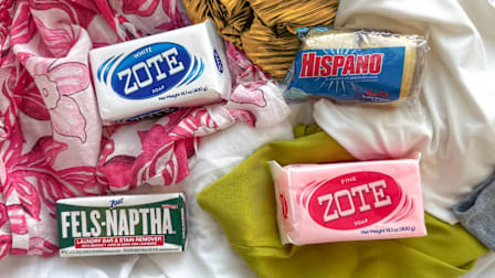Zote, Hispano, and Fels-Naptha soaps on a pile of laundry