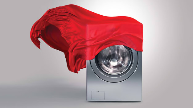 washer with red fabric blowing off of it