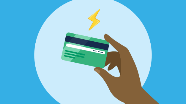 Hand holding a credit card with a lightning bolt