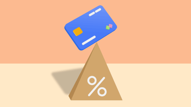 Credit card sitting on top a percentage pyramid.