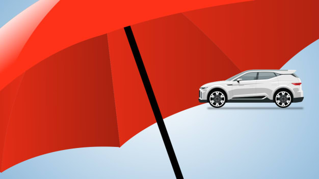 White SUV with under larger red umbrella