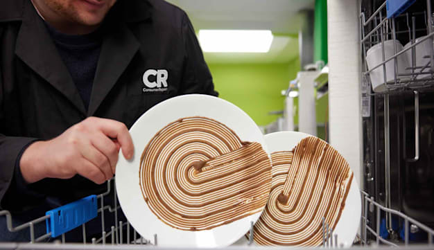 detail of CR tester loading dishwasher with soiled dish for testing