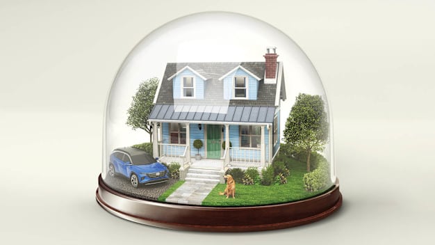 Glass dome with a house, car and dog protected
