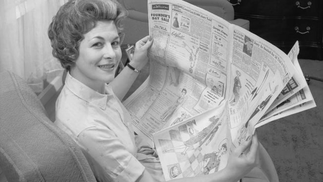 Vintage photo of woman with newspaper