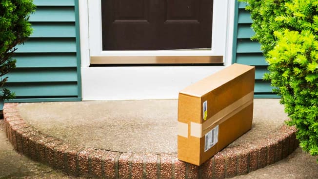 Package delivered to front door of home.