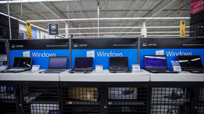 Laptops on display at a Walmart.
