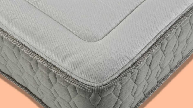 detail of corner of bare mattress