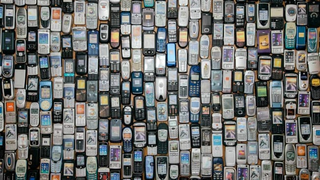 grid of old cell phones