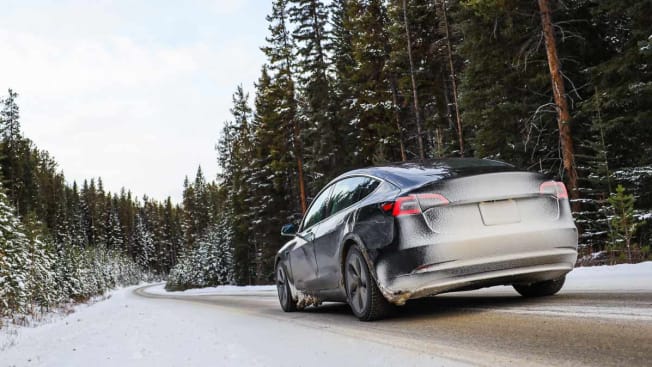 Tesla, an EV driving in the winter
