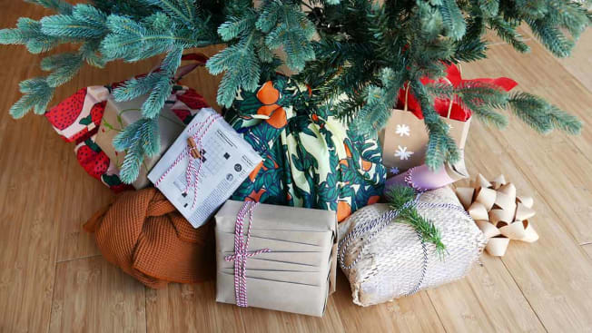 Christmas tree with eco-wrapped gifts underneath.