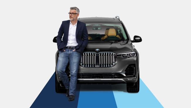 Person standing next to a BMW X7