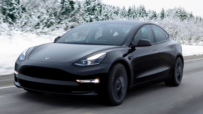Tesla Model 3 driving in the snow
