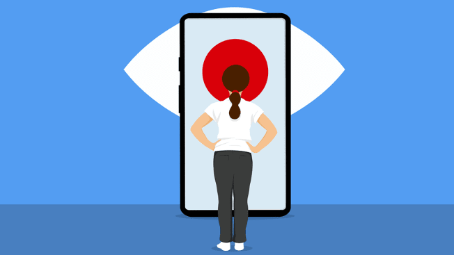 Person looking at a red dot on their cell phone, the red dot is part of a large eye.