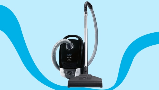 black vacuum cleaner on a blue background
