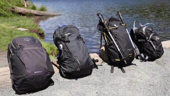 four black hiking backpacks