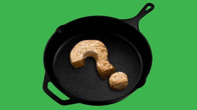 photo illustration of cast iron skillet with ground poultry in the shape of a question mark