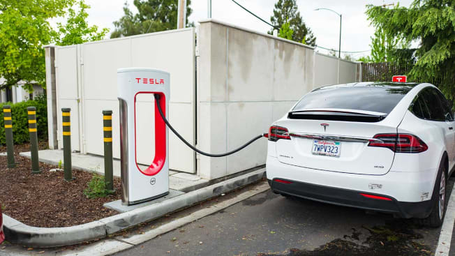 A Tesla Motors Model X SUV is charging at a supercharger station in the Silicon Valley town of Mountain View, California, April 7, 2017