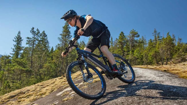 Person riding NCM Moscow Electric Mountain Bike