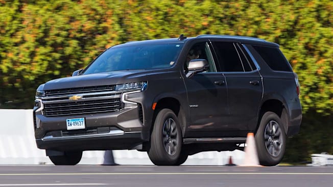 2021 Chevy Tahoe being tested on Consumer Reports test track, person maneuvering around orange cones