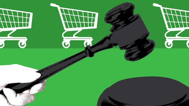 illustration of hand holding gavel with grocery carts in the background