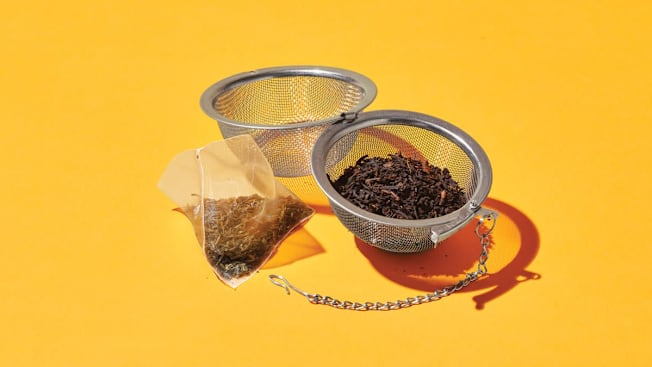 a tea bag and a tea diffuser with loose leaf tea