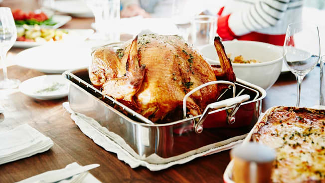 a cooked turkey on a dining table