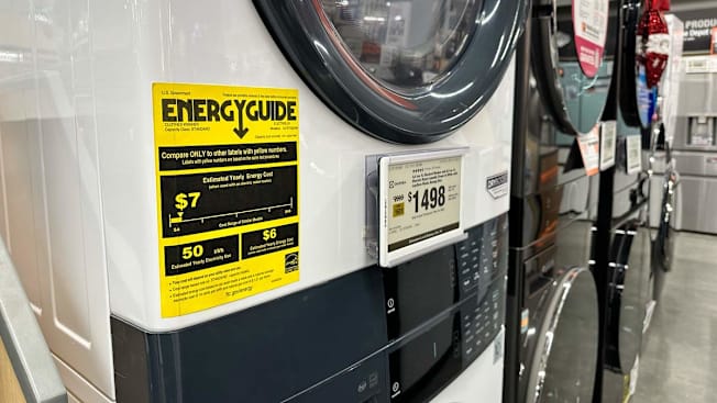 close up of Energy Guide label on white washer and dryer pair, with other washer and dryer pairs in the background