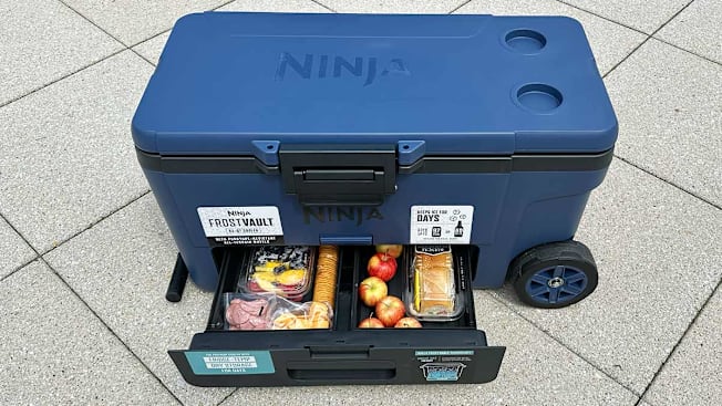 The Ninja Frost Vault seen with its dry storage drawer open with perishable snacks inside.