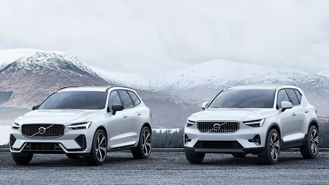 2024 Volvo XC60 and XC40 in front of snow-capped mountains