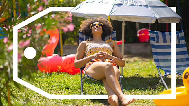 Woman relaxing in a lawn chair with a patio umbrella in a backyard with a deals tag surrounding her.