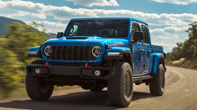 2025 Jeep Gladiator Mojave X front driving on dirt road