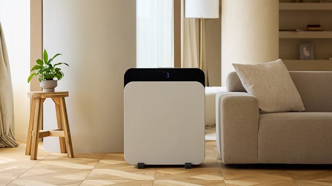 Blueair air purifier in room with couch