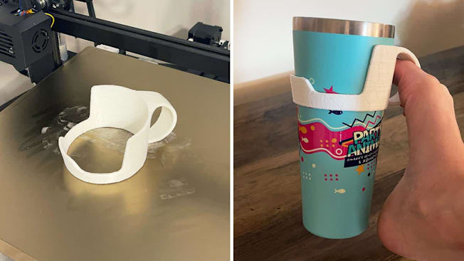 An adaptive cup holder sitting on the 3D printer and a foot using the printed cup holder to hold a insulated cup.