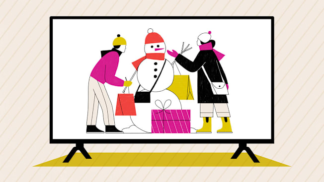 Two people building a snowman with shopping bags and gifts, shown on a large television screen.