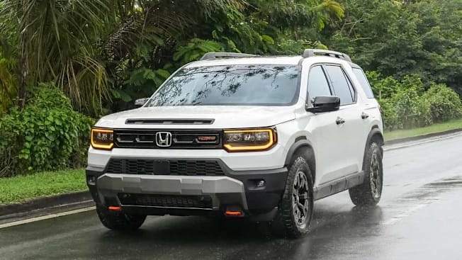 2026 Honda Passport driving on a road.