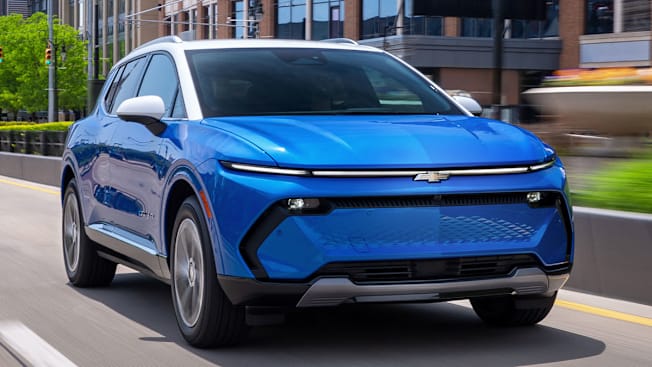 2025 Chevrolet Equinox EV driving in city