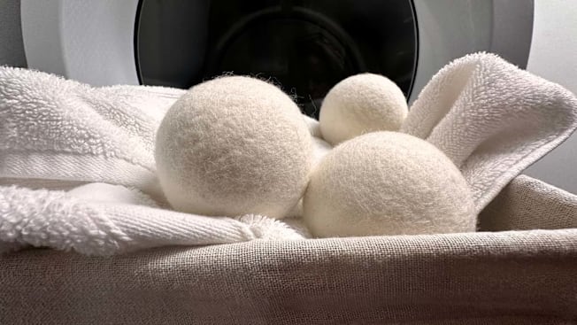 Everspring dryer balls in a basket of laundry