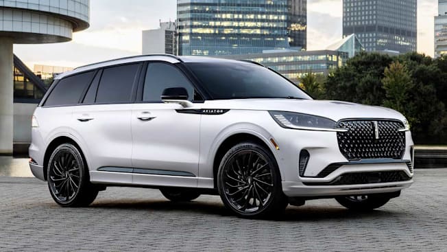 grey Lincoln Aviator with city buildings in background